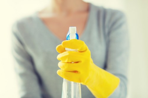 Commercial cleaning specialist disinfecting high-touch office surfaces