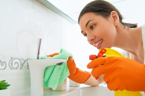 Bathroom house cleaning with sparkling fixtures
