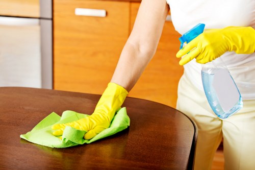 Commercial cleaning team sanitizing office surfaces and common areas